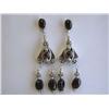 Image 1 : Dangling Silver and Ruby Earrings