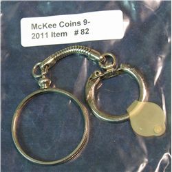 82, Key Chain and Bezel for a Silver Half-Dollar.