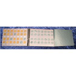 666. 1948-58 Partial Set of Lincoln Cents in a Merit Coin holder.