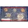 Image 2 : 752. 1999 D Cent, Nickel, Dime, & Half Dollar in red cellophane