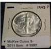 1592. 1943 P Walking Liberty Half. Nearly full thumb MS 65.