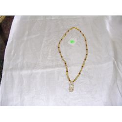 Ivory and glass bead necklace with Billikan