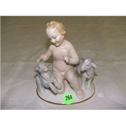 small Bavaria porcelain nude boy with goats