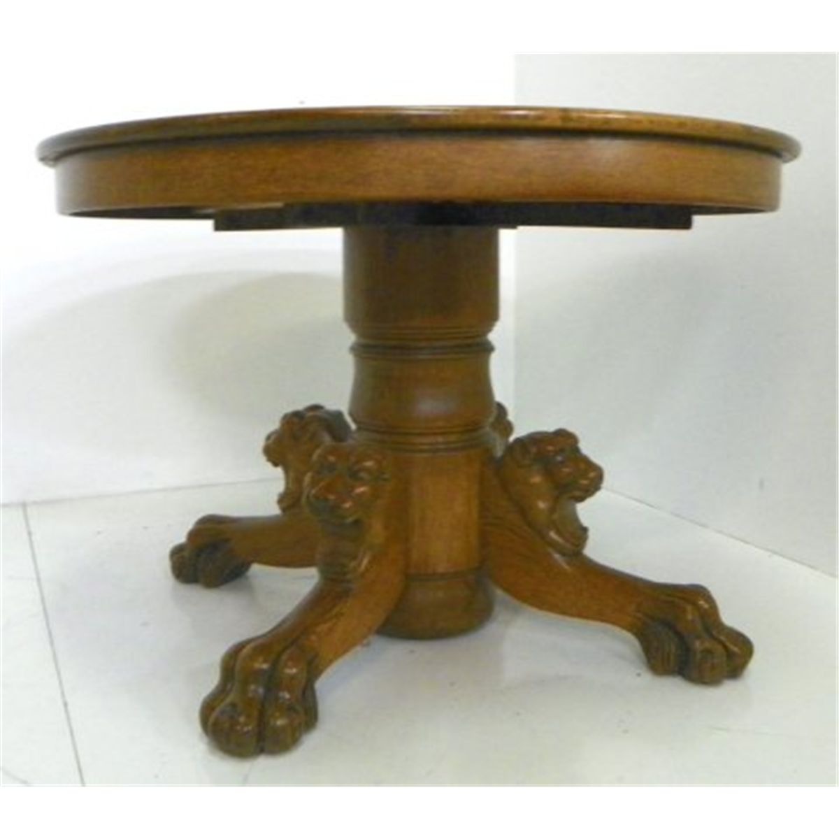 Victorian oak round table with lion head claw base