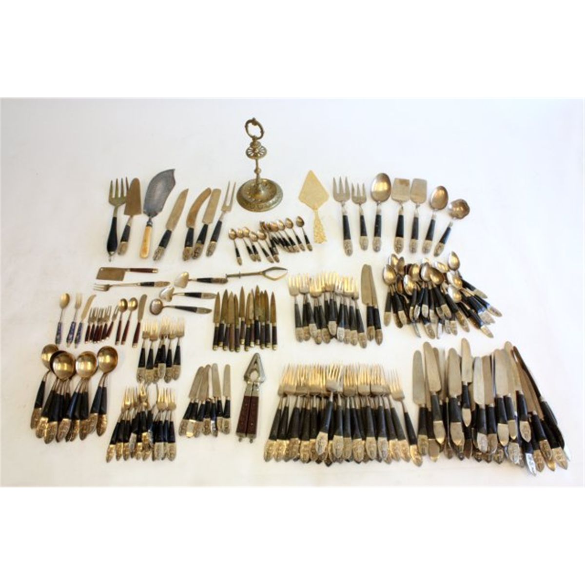 Figural brass silverware set made in Thailand