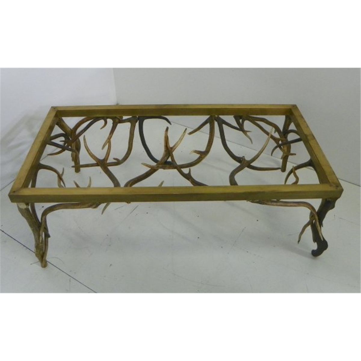 Glass topped coffee table with real antler base