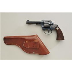 Colt Police Positive, .38 caliber,  double-action revolver, 4” barrel, blued  finish, checkered wood