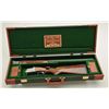Image 1 : SKB model 686 20ga over/under shotgun,  limited edition one-of-a-kind engraved by  Angelo Bee. 28” b