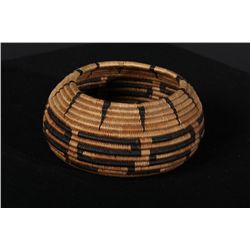 Finely woven Pomo basket, approx. 4-1/2”  across center, nearly 2” deep, bowl shape.  Good pattern, 