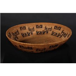 Nicely woven mission basket, approx. 14-3/4”  across center by 3-1/2” deep. Good geometric  figures,