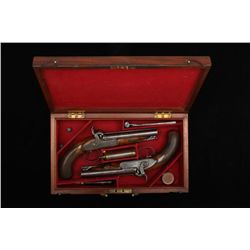 Pair of double-barrel percussion officer’s  pistols by Collins of London. Cased with  accessories, c