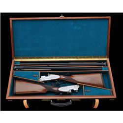 Cased pair of Beretta SL3 grade over/under 12  gauge shotguns. Both 28” barrels, nicely  scroll engr