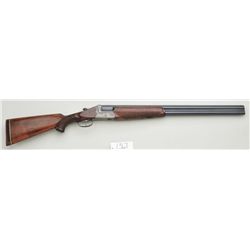 Ferlach O/U shotgun, 12 gauge, 26” barrels,  blue finish to barrels, engraved game birds  on receive