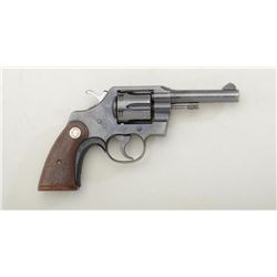 Colt Official Police DA revolver, .38 Special  cal., 4” barrel, blue finish, checkered  medallion wo