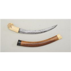 Ivory handled Southeast Asian style curved  blade knife with exotic wood sheath with  accented dark 