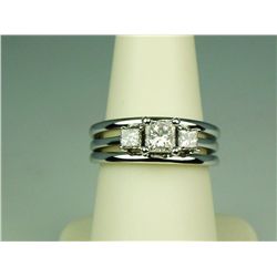 Brilliant 14 karat white gold ladies three  stone wedding set by ‘Shane and Co.’ set with  a center 