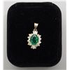 Image 1 : 18kt oval emerald (approx 2.75ct) and diamond  pendant. Six baguette diamonds weighing  0.30ct and 1