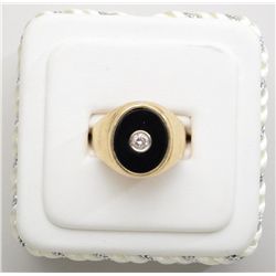 Gents 14k yellow gold (9gms) ring set with a  black onyx embedded with a round diamond.  Est. $850-$