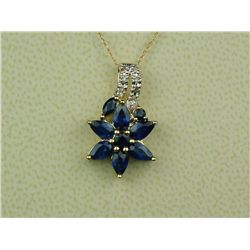 Elegant 14 karat yellow gold ladies flower  design necklace set with 8 fine cornflower  blue sapphir