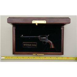 Modern wood cased miniature Colt SAA  revolver, blue and case hardened finish, wood  grips, #1. This