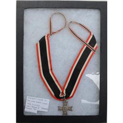 German Knight’s Cross on red, white and black  ribbon in overall fine condition with  swastika in ce