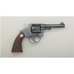 Colt Police Positive DA revolver, .38 cal.,  4” barrel, blue finish, checkered medallion  wood grips