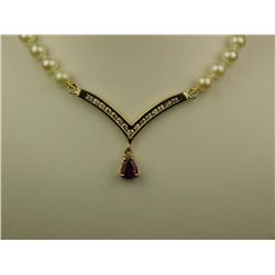 Very elegant 14 karat yellow gold ladies  pearl necklace set with a pear shape pink  tourmaline and 