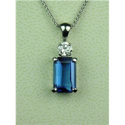 Spectacular 14 karat white gold ladies custom  made necklace set with a fine color Emerald  cut Tanz