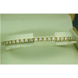 Elegant 14 karat yellow gold ladies tennis  bracelet set with 50 round brilliant cut  diamonds weigh