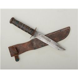 KaBar military style fighting knife with  leather sheath in overall fair condition  showing stacked 