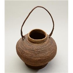 Beautiful early Indian woven basket with  woven handle approx. 10” in height and  approx. 12” in dia
