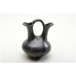 Older Santa Clara pueblo wedding pot approx.  9” in height and in overall very good  condition.  Est