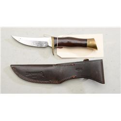 Browning Sportsman’s hunting knife with  leather sheath; overall good condition and  may clean to fi