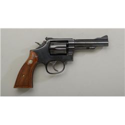 Smith & Wesson Model 15-4 DA revolver, .38  cal., 4” barrel, blue finish, checkered wood  medallion 