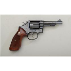 Smith & Wesson Model 10-7 DA revolver, .38  Special cal., 4” barrel, blue finish,  checkered medalli