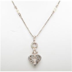 Sterling silver heart and key pendant with a  16" chain. Est.: $85-$100.