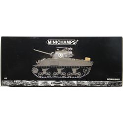 Lot of three military toy models including a  Sherman Tank, in the factory box; a  helicopter in ove