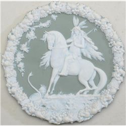 Jasperwood plate with figure of an American  Indian on horseback, approx. 7” in diameter,  green bac