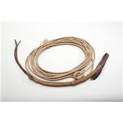 Antique braided rawhide lariat with hondo,  and a braided riding quirt or whip. Both from  an old te