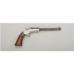 Stevens tip up single shot pistol, .22 cal.,  6” round barrel, blue and nickel finish, wood  grips, 