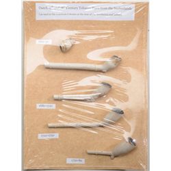 Lot of five early Dutch 17th and 18th Century  tobacco pipes from the Netherlands on a  cardboard ba