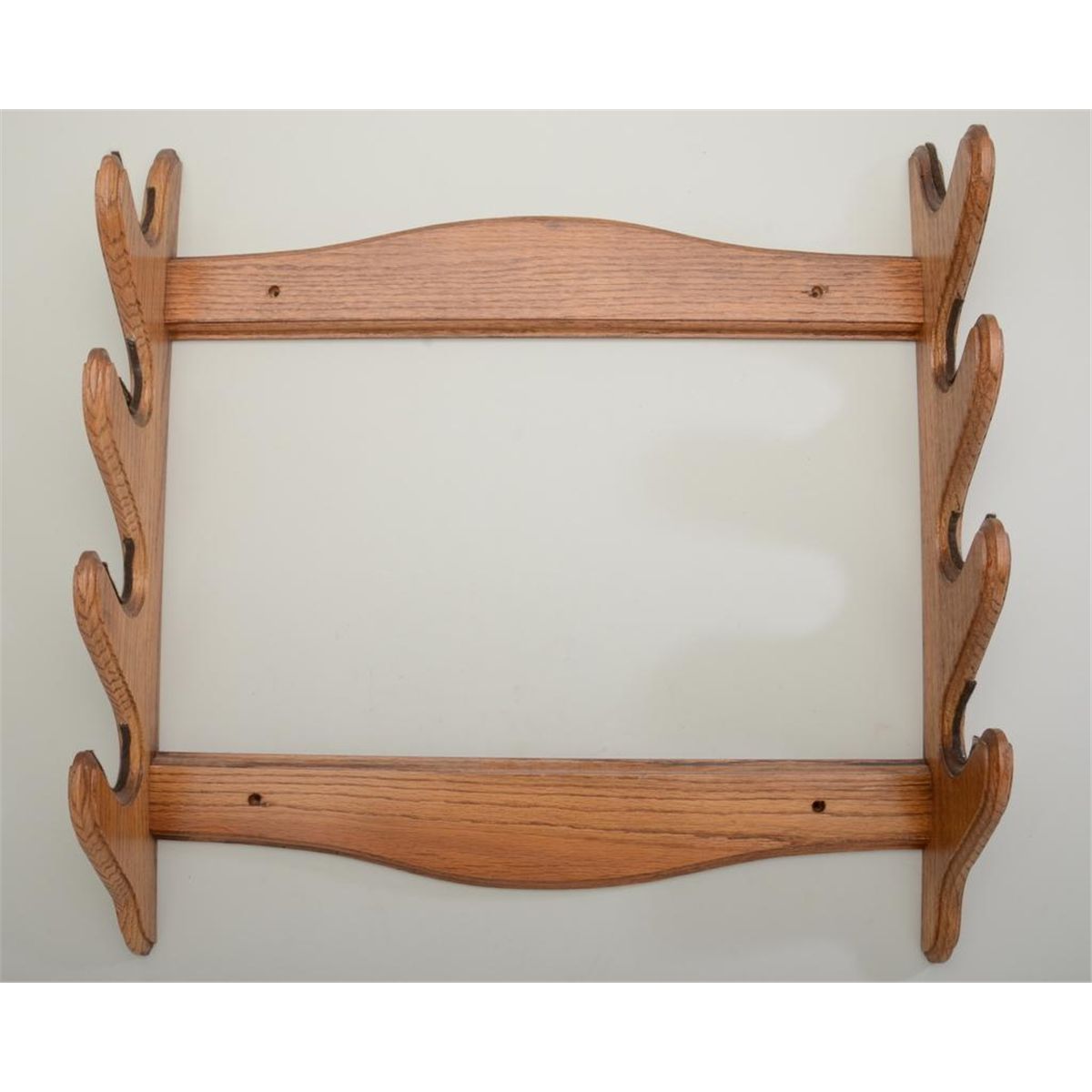 Four position oak wall hanging rifle rack in overall fine condition ...
