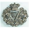 Image 1 : circa 1890: Royal Irish Regiment officer's pith helmet badge
