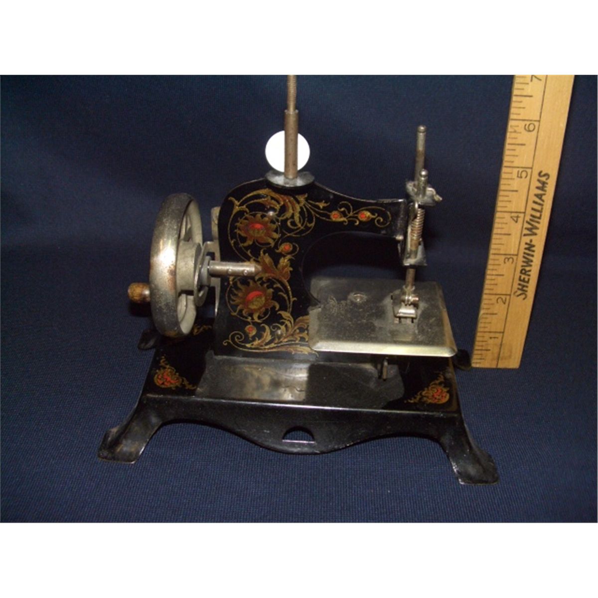 antique child's hand crank metal sewing machine made in Germany, great