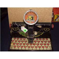 vintage childs metal toy "De-Luxe Dail "typewriter by Marx