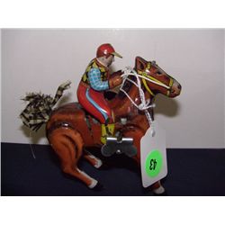 made in Japan wind up tin race horse with rider, hops around fast