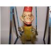 Image 2 : very old child's swinging monkey toy on metal swing frame