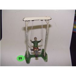 lead toy boy on swing, made in France, string replaced