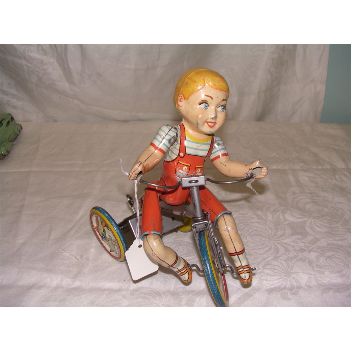 tin wind up Unique Art toy, boy on trike, Kiddy Cyclist