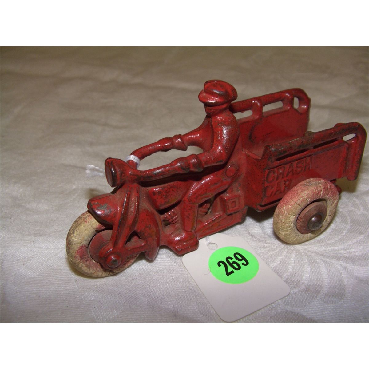antique cast iron toy crash car toy motorcycle and driver